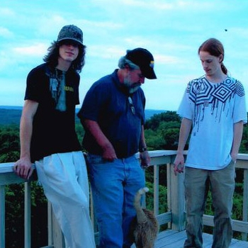 Brian with sons Dylan and Wylder and cat “Doodles” on the deck of their Newtown, Ct. house in 2008